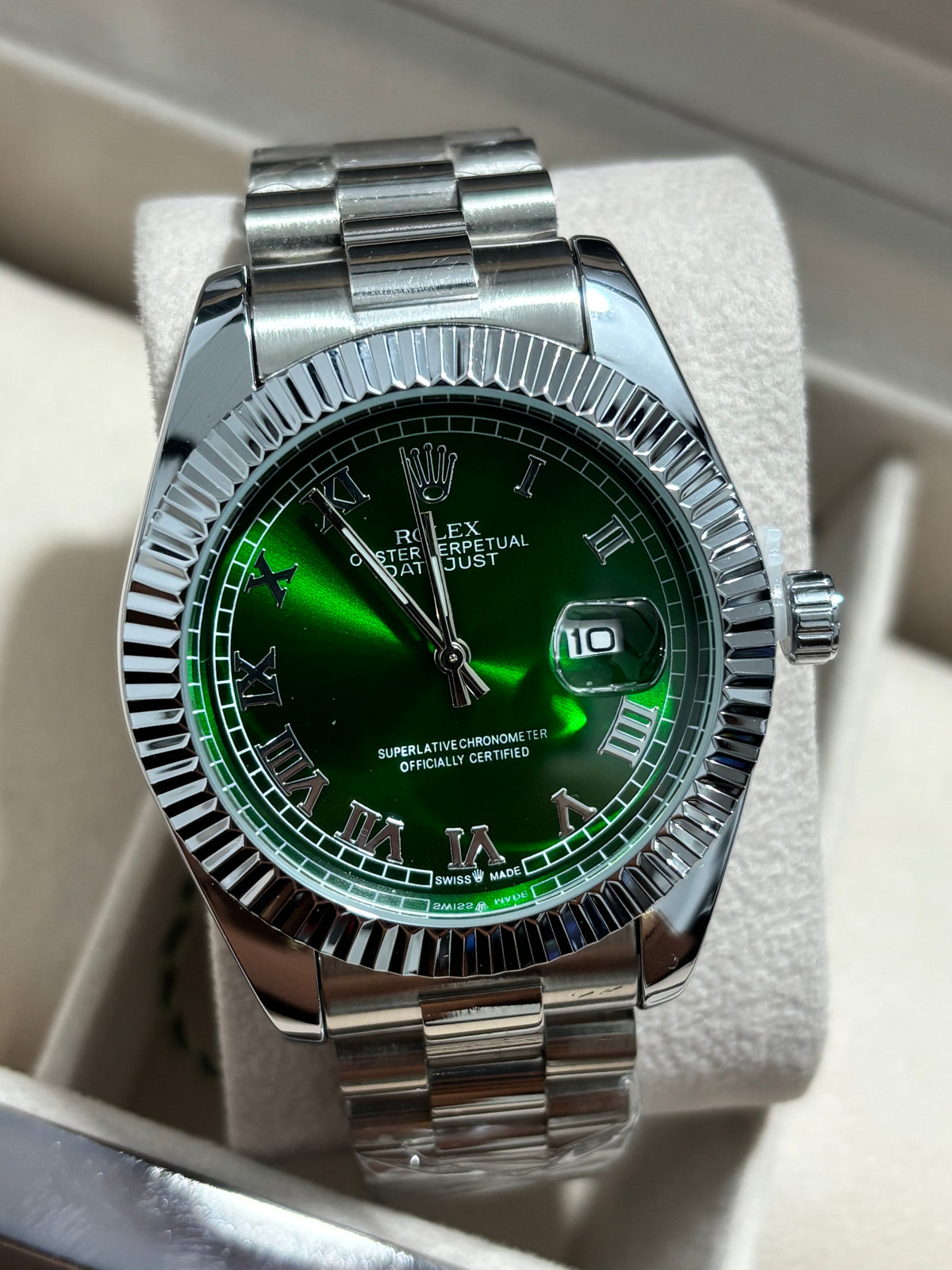 Rx roman plateado fondo verde