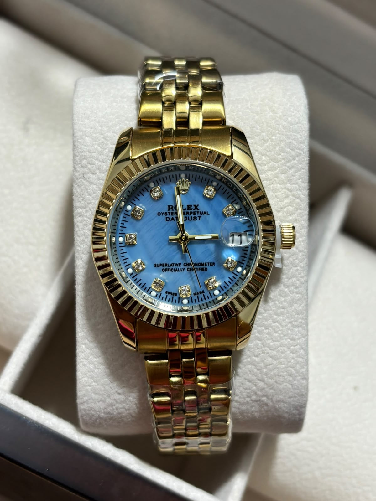 RX DAMA dorado fondo azul oscuro