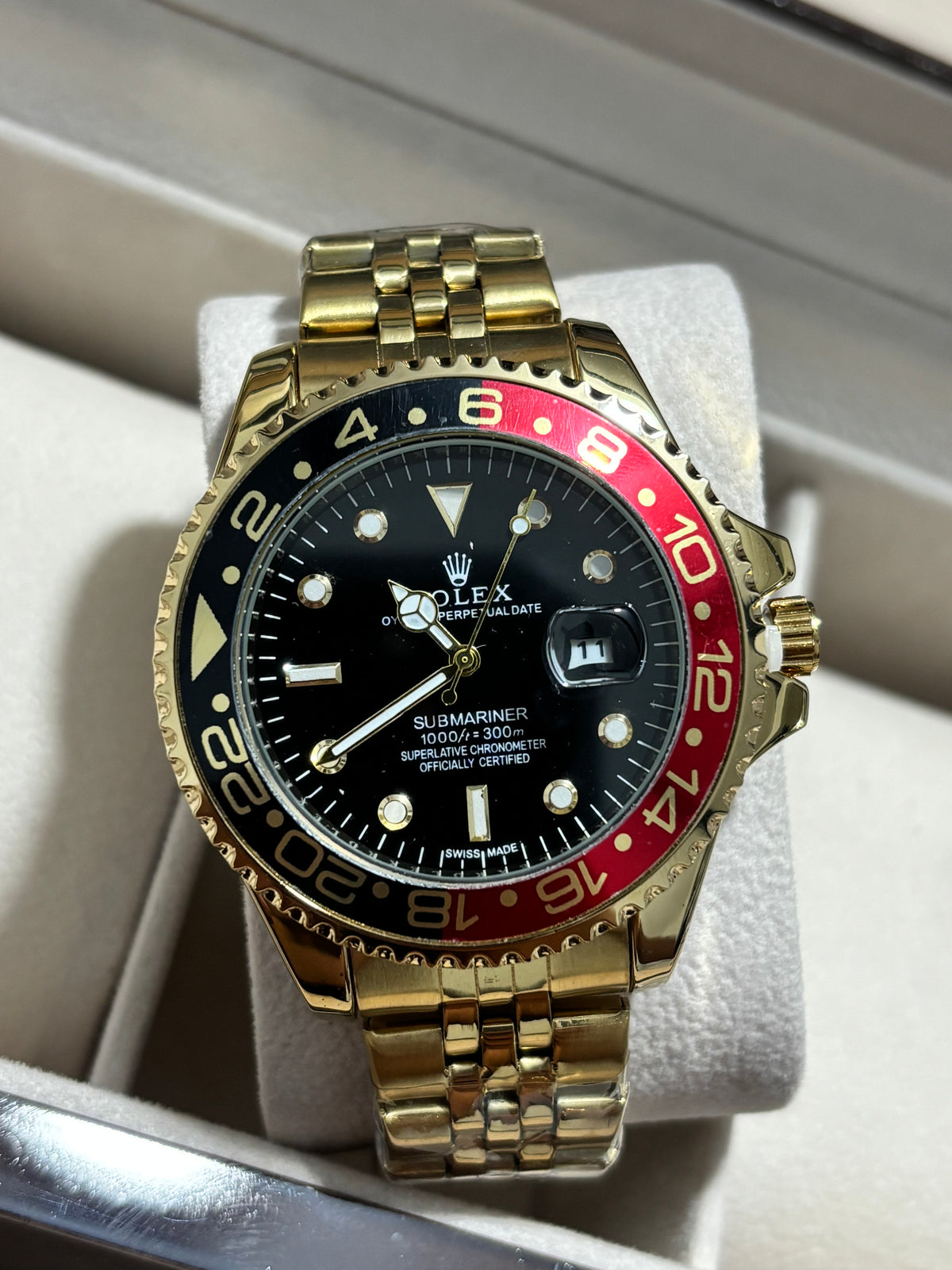 RX SUBM II dorado bisel negro rojo fondo negro