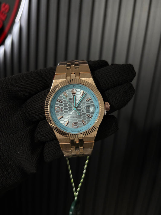 Rx landwr r963 oro rosa fondo azul claro